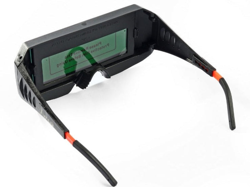 Auto-darkening welding glasses