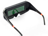 Auto-darkening welding glasses