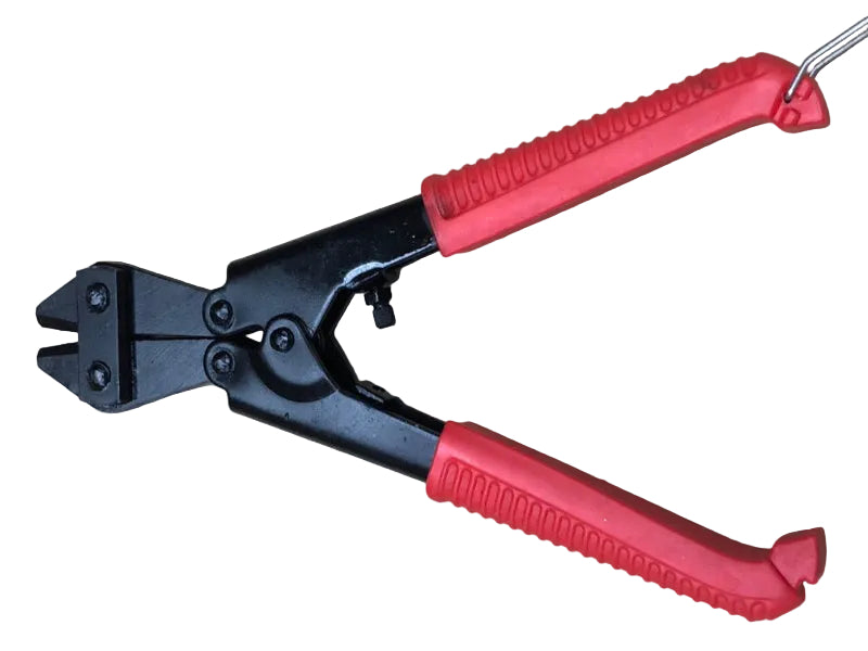 Pair of wire cutters with red handles on a beige surface